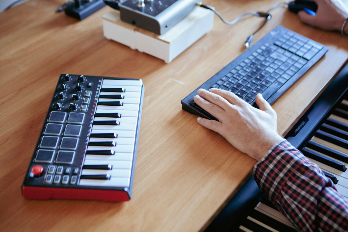Producer Composing Music in Home Studio
